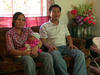 A couple with their baby at home