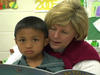 Boy from Burma with his teacher at school