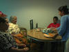 A Bhutanese family sitting down to eat