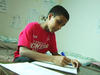 A Bhutanese boy doing homework