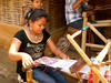 Woman weaving in the refugee camp